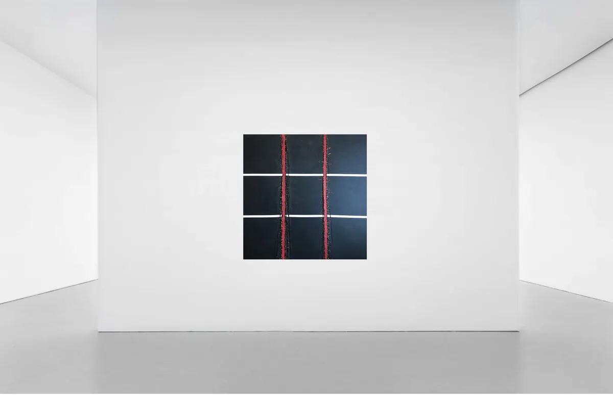 Stock photograph of two framed works on a plain white gallery wall.