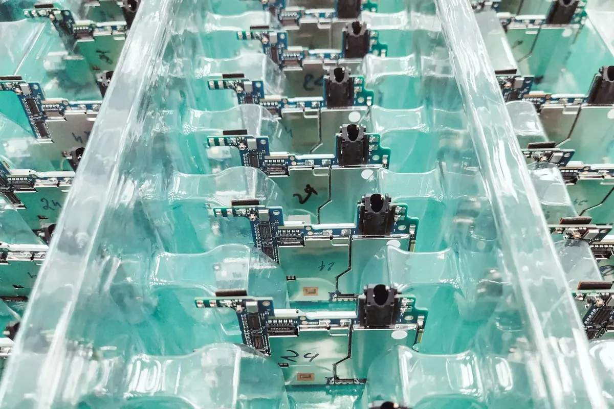 Rows of part-assembled electronic units moving along a production line